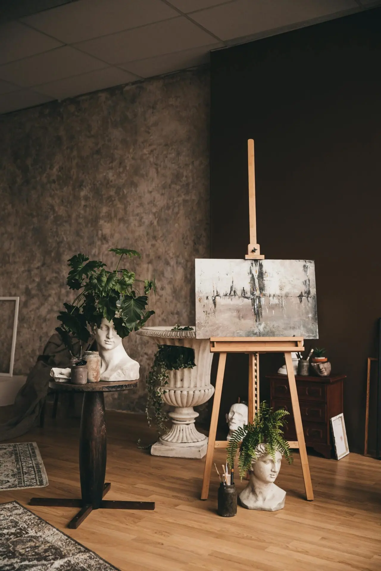 Creative home art studio with a sculpture and painting easel